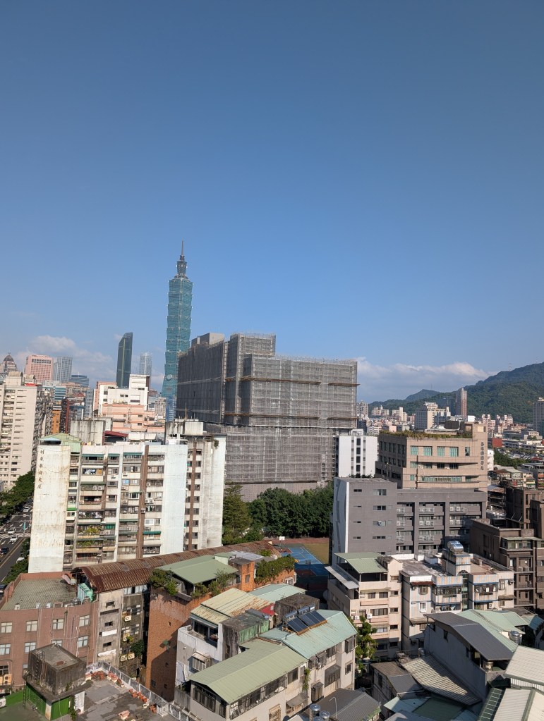 a city view of Taipei. the building Taipei 101 is in the distance
